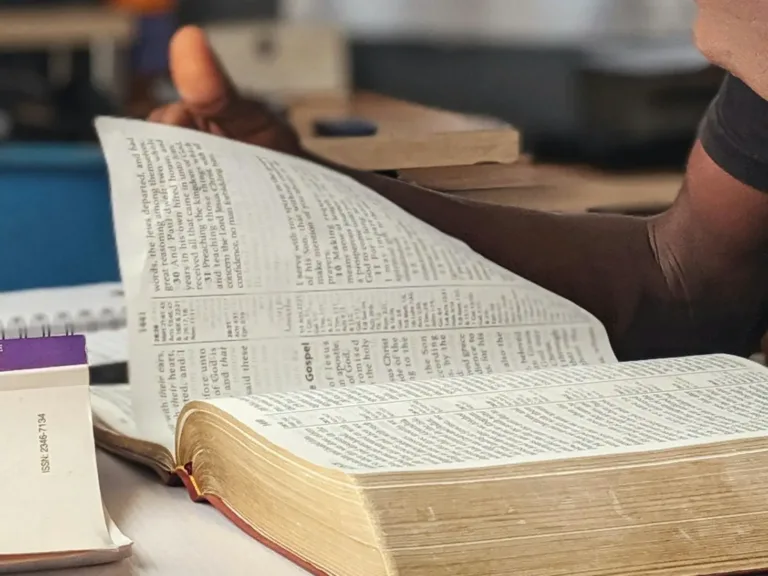 Photo of a man studying the Bible