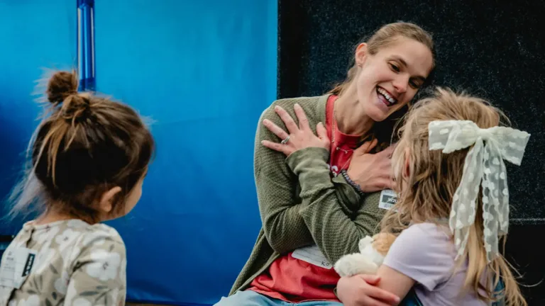 Teacher playing with kids at Harvest Ridge Church